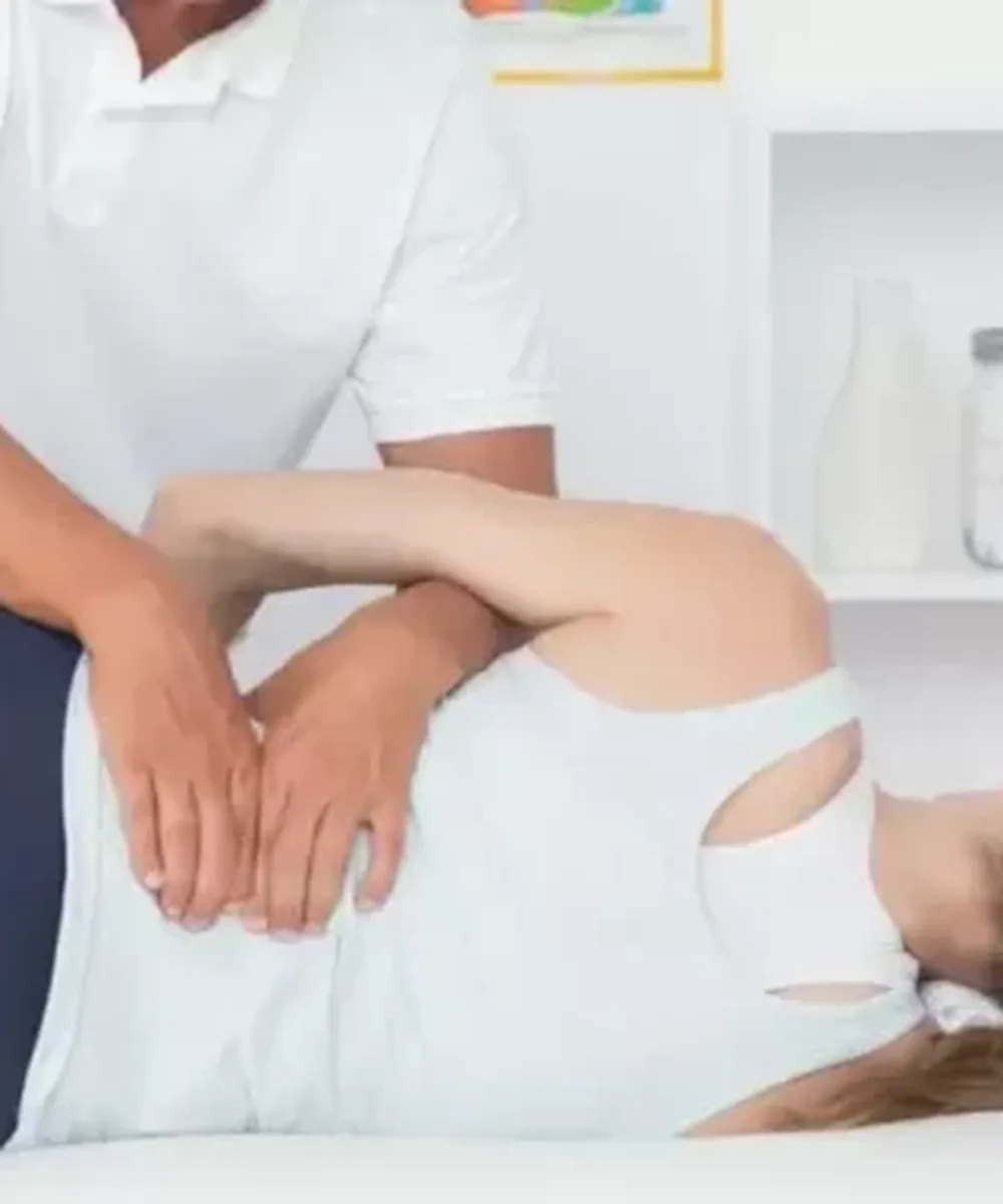 A Doctor of Physical Therapy evaluating back pain and sciatica at Zone Physical Therapy in Greer, SC