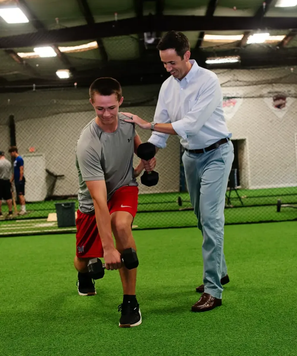 A Doctor of Physical Therapy evaluating a golf injury at Zone Physical Therapy in Greer, SC