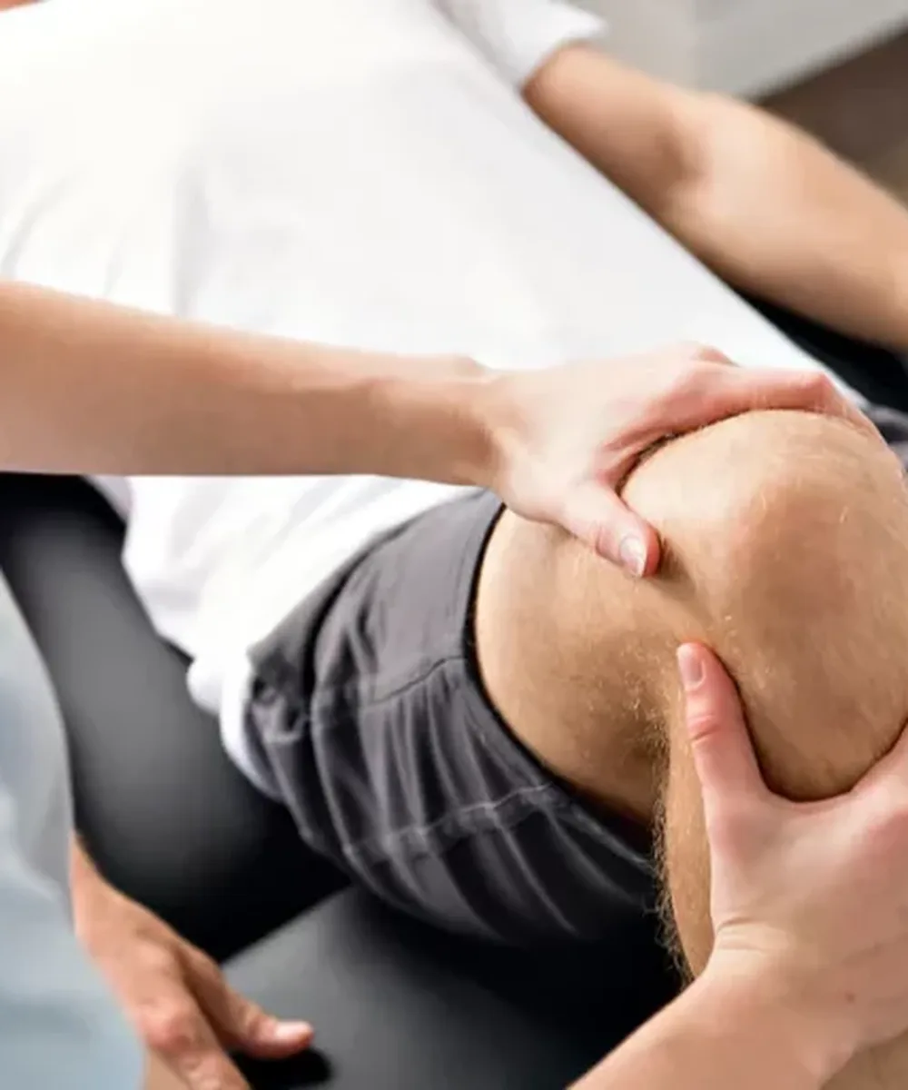 A Doctor of Physical Therapy evaluating hip and knee pain at Zone Physical Therapy in Greer, SC