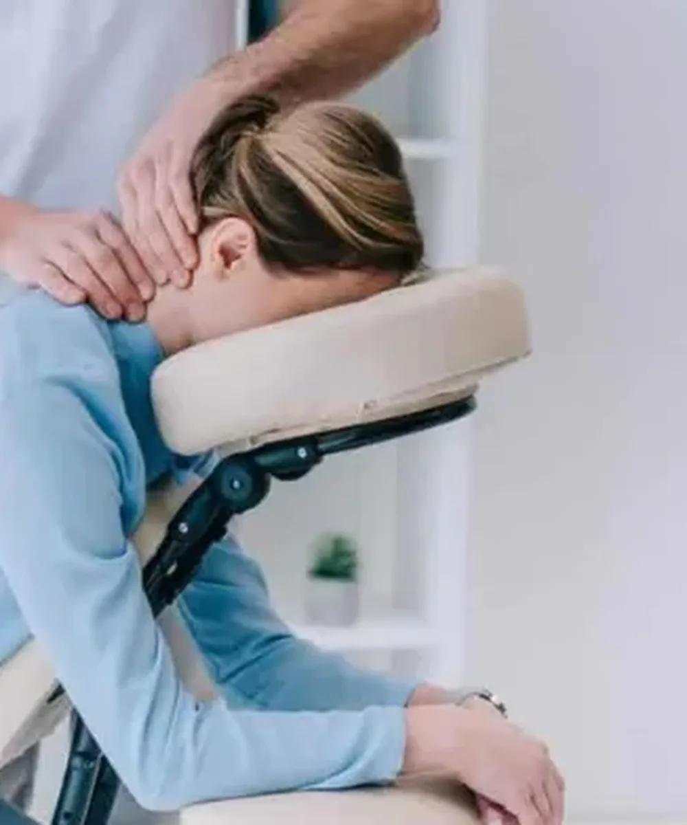 A Doctor of Physical Therapy evaluating neck pain at Zone Physical Therapy in Greer, SC