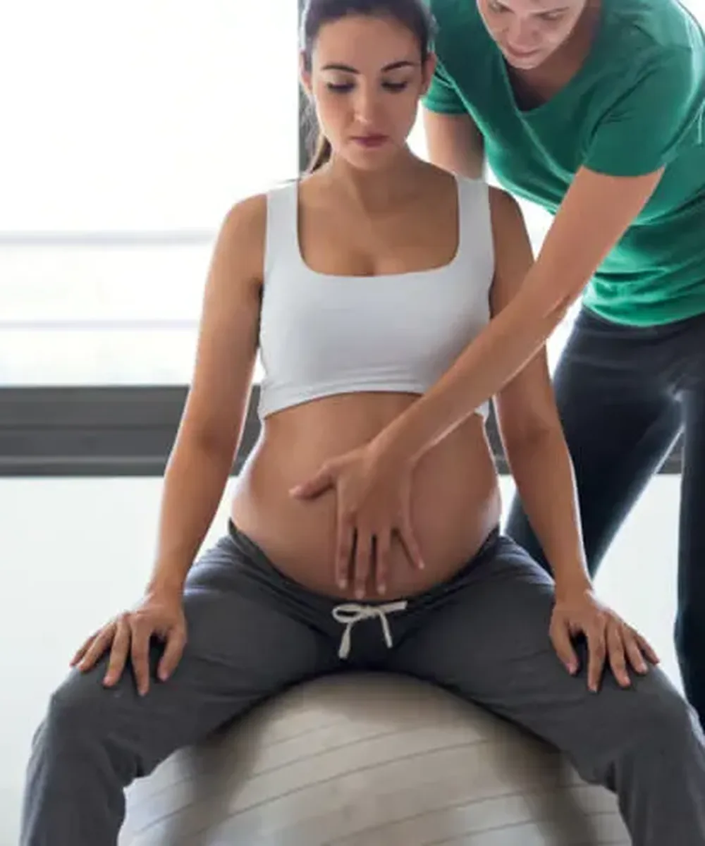 A Doctor of Physical Therapy guiding a pre/postnatal patient at Zone Physical Therapy in Greer, SC